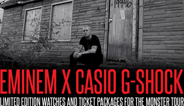 Eminem sitting next to his house